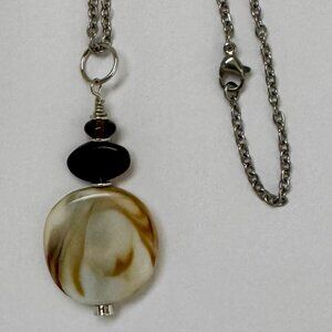 Necklace off white swirled caramel glass medallion/tortoise beads Silver Trim